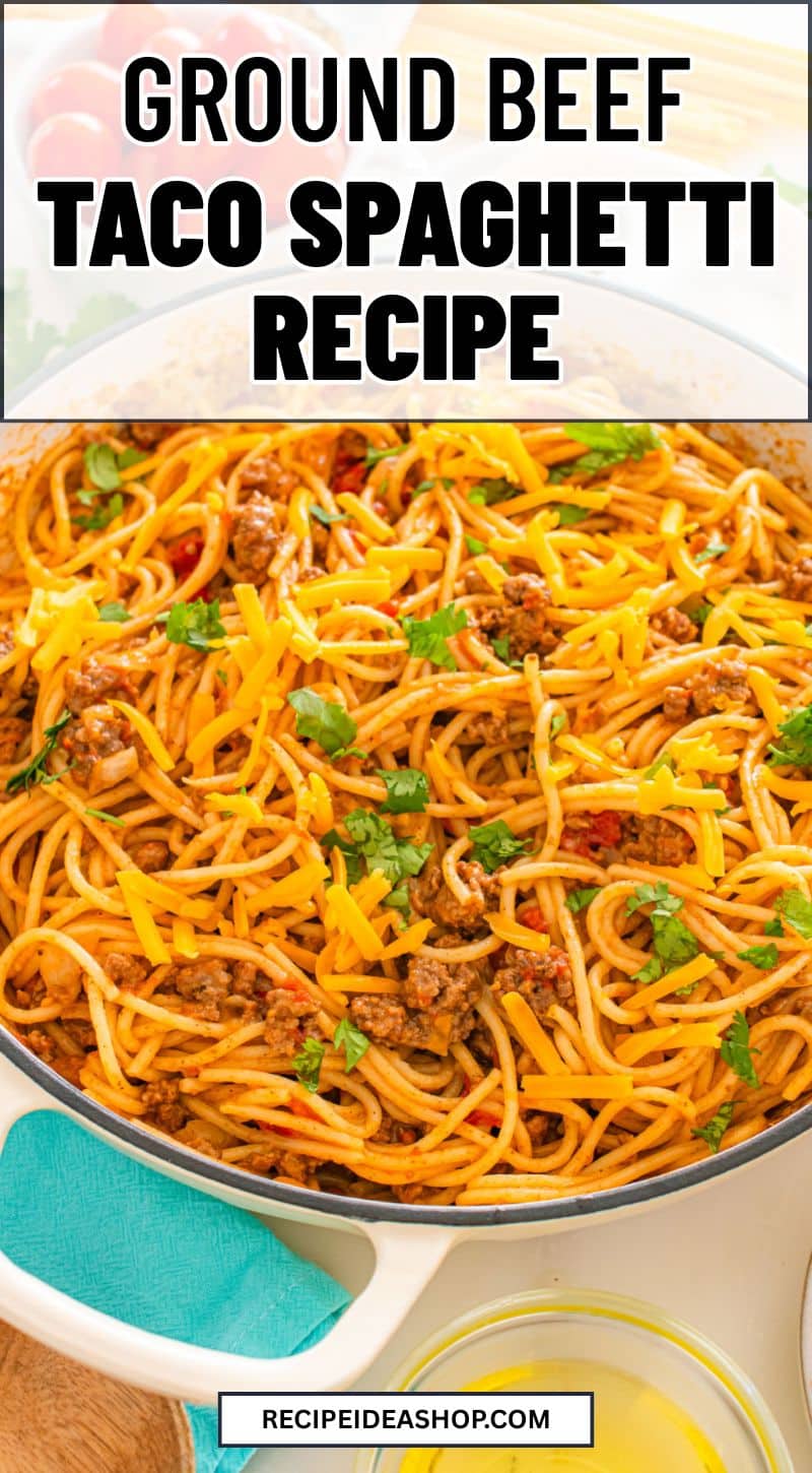 A skillet filled with taco spaghetti—spaghetti mixed with ground beef, tomato sauce, and garnished with chopped cilantro. A teal napkin and a glass bowl are nearby. Text on the image reads “Ground Beef Taco Spaghetti Recipe.”.