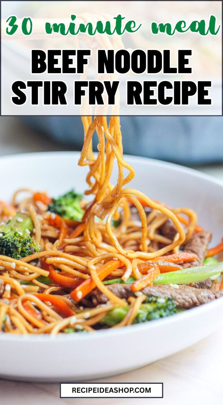 A bowl of Beef Noodle Stir Fry with broccoli, carrots, and noodles being lifted by a fork. Text over image reads: 30 minute meal, Beef Noodle Stir Fry Recipe. Website recipeideashop.com appears at the bottom.