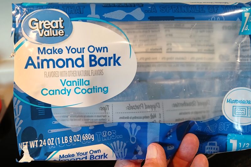 A 24-ounce package of Great Value Vanilla Almond Bark, perfect for making pretzel candy.